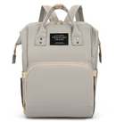 Stylish mommy backpack diaper bag in gray, designed for functionality and convenience for moms on the go.