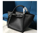 Versatile shoulder crossbody tote bag in stylish black leather with unique handle design.