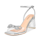 ISNOM silver rhinestone heels for women with clear chunky heel and bow detail, stylish footwear for special occasions.