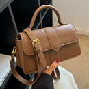 Women’s commuter messenger bag in stylish brown leather with adjustable strap and elegant design.