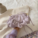 Versatile crossbody shoulder bag in soft lavender with ruffled detailing, perfect for everyday use.