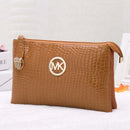 Stylish Crossbody, Shoulder Bag, Clutch Bag in tan crocodile pattern with MK logo for urban adventurers.