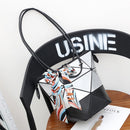 Stunning women's versatile handbag with stylish scarf detail, ideal for various occasions, placed on a chair.