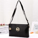 Crossbody, Shoulder Bag, Clutch Bag in sleek black with crocodile texture and gold logo accents.