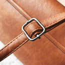 Detail of the strap and buckle on a stylish tassel handbag for modern women.
