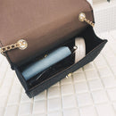 Inside view of fringe crossbody bag showing soft nylon lining and items organized neatly.