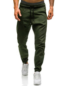 Casual pants for men in dark green, featuring a comfortable mid-waist design and drawstring, perfect for all casual occasions.