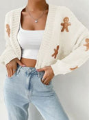 women's gingerbread cardigan featuring a cozy white knit with gingerbread man details, perfect for fall and winter layering.
