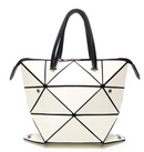 Women's versatile handbag, chic white geometric design with black accents, perfect for any occasion.