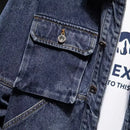 Close-up of a loose fit youth denim jacket autumn winter with multi-pocket design and denim texture.