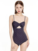 Women's One-Piece Swimsuit with Modest Fit and Support featuring a stylish bow design and polka dots.