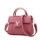 versatile shoulder crossbody tote bag in pink PU leather with gold accents and top handle
