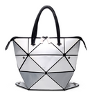 Stylish women's versatile handbag with geometric design, easily convertible to crossbody or shoulder bag.