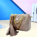 Handbag, Shoulder Bag, Crossbody Bag in woven design with gold chain and tassel detail on a colorful background.