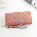 Women's large capacity zipper wallet in pink PU leather with heart designs and a wrist strap, perfect for stylish storage.