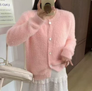 Stylish women's woolen cardigan in soft pink, perfect for layering and keeping cozy this season.