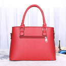 Versatile crossbody handbag in red with dual handles and zip pocket, perfect for stylish and functional use.