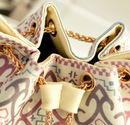 Close-up of ethnic style canvas bucket bag showcasing the unique design and chain details.