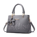 Women's Handbag, Shoulder Bag, Crossbody Bag in stylish gray with floral design and bow detail.