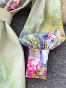 Vintage evening dress for women sleeve detail with floral print and elegant design.
