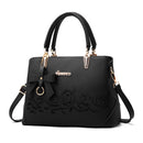 Women's Handbag, Shoulder Bag, Crossbody Bag featuring a stylish black design with floral detailing and bow accent.