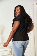 Model wearing a black eyelet flutter sleeve top, showcasing the stylish design from the back.