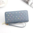 Stylish women's large capacity zipper wallet in blue with heart designs and wrist strap.