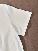 Close-up of a white short sleeve on a vintage style casual t-shirt women, showcasing the fabric texture.