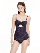 Women's One-Piece Swimsuit with Modest Fit and Support in navy with polka dots and a stylish bow detail