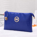 Crossbody, Shoulder Bag, Clutch Bag in vibrant blue with stylish gold logo detailing.