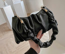 Versatile crossbody shoulder bag in black, crafted from PU with unique design and stylish handles.