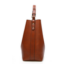 Women's tote crossbody bag in brown PU material, showcasing a stylish design and adjustable strap.
