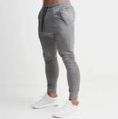Men long slim fit casual pants for men in gray with elastic waist and lace-up detail, perfect for autumn and winter.