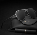 Polarized sunglasses for men with stylish black frame and high-quality lenses on a black background.