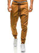 Trendy casual pants for men in brown, featuring a relaxed fit and drawstring waist for maximum comfort.