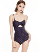 Women's One-Piece Swimsuit with Modest Fit and Support in navy with polka dots and ruffle details.