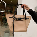Versatile shoulder crossbody tote bag in beige with black accents, perfect for any occasion.