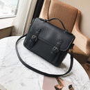Tassel handbag for modern women placed on a marble table next to a cozy chair, showcasing its stylish design.