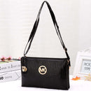 Crossbody, Shoulder Bag, Clutch Bag featuring a stylish black crocodile design and gold logo detail.