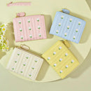 Cute embroidered women's wallet in pink, blue, yellow, and beige with floral design, perfect for stylish organization.