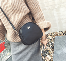 Crown Mini Shoulder Crossbody Bag worn with a cozy sweater, showcasing its stylish design and practicality.