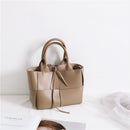 Vintage women's woven crossbody handbag in neutral tones, stylish and durable for any occasion.