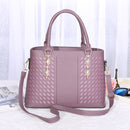 Versatile crossbody handbag in purple with stylish woven design and dual handles, ideal for various occasions.