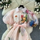 floral a-line long dress women with lantern sleeves and floral design in soft pastel colors