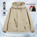 Unisex lightweight waterproof hiking jacket in beige, featuring a hood and zippered pockets for outdoor activities.