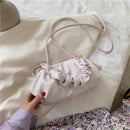 Versatile crossbody shoulder bag in soft lavender color with ruffle design, perfect for everyday use.