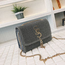Fringe crossbody bag in grey with gold chain strap and tassel detail, perfect for stylish daily use.
