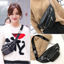 Versatile crossbody phone bag styled with a cozy sweater, featuring multiple zippers and a sleek design for on-the-go functionality.