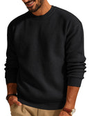 Men's waffle crewneck sweater in black, featuring a classic design and comfortable knit fabric.