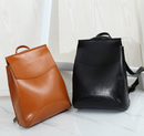 Stylish travel backpack for women in brown and black PU material, perfect for travel and everyday use.